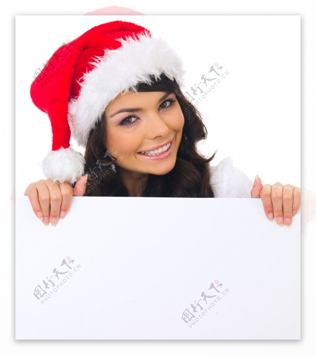 空白广告牌后面的圣诞漂亮美女图片