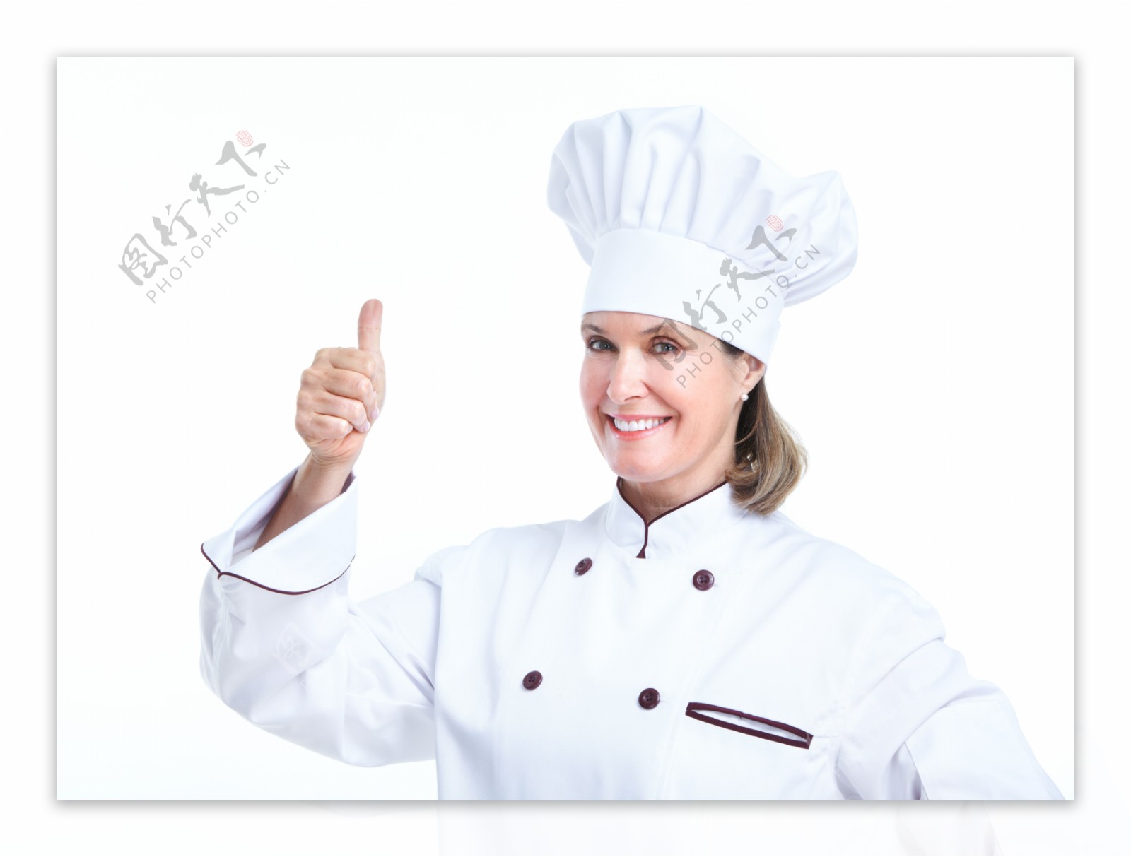 伸出大拇指的女厨师图片